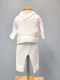 White knit baby boy outfit with collar.