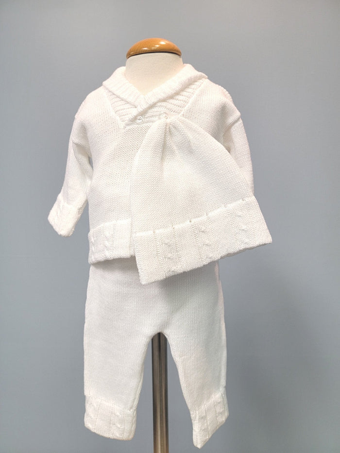 White knit baby boy outfit with collar and bonnet.