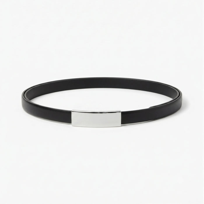 A minimalist black belt with a polished silver rectangular plate in the center, displayed on a clean white background. | Lead