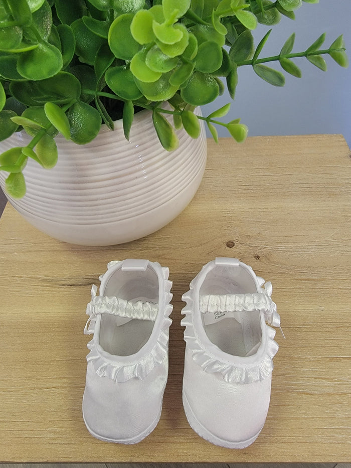 Satin and ruffle white baby booties.