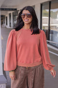 Mineral washed rust balloon sleeve pullover sweatshirt with ribbed details by Jodifl