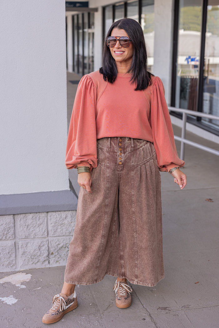 Mineral washed rust balloon sleeve pullover sweatshirt with ribbed details by Jodifl showing full front view
