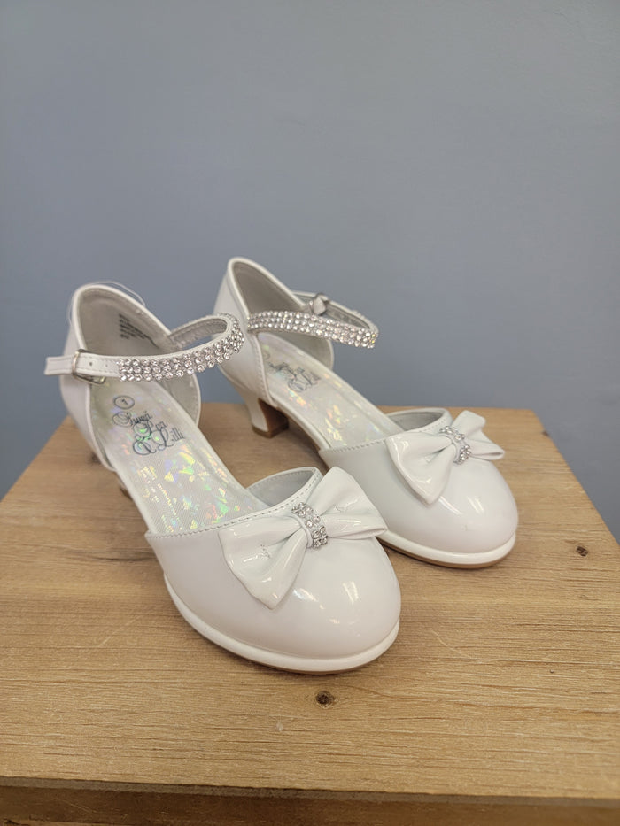 white girls shoe with ankle strap and bow on toe
