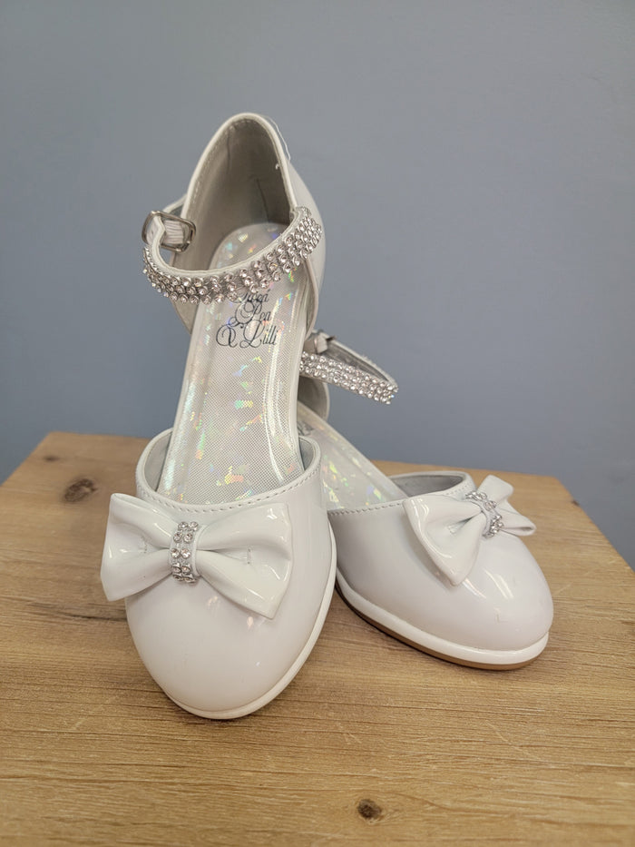 white girls shoe with ankle strap and bow on toe