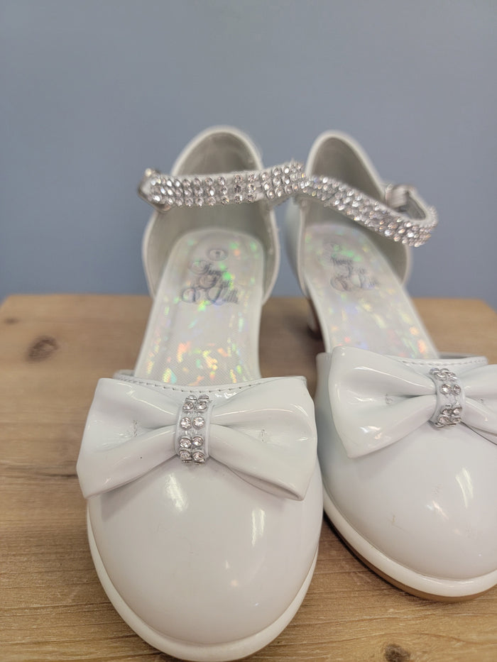 white girls shoe with ankle strap and bow on toe