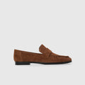 Brown loafer shoe on a light gray background | Lead