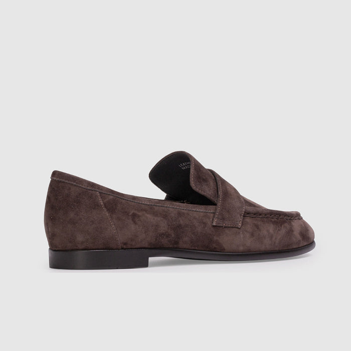 Brown suede loafer on a light gray background