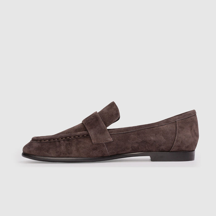 Brown suede loafer on a white background