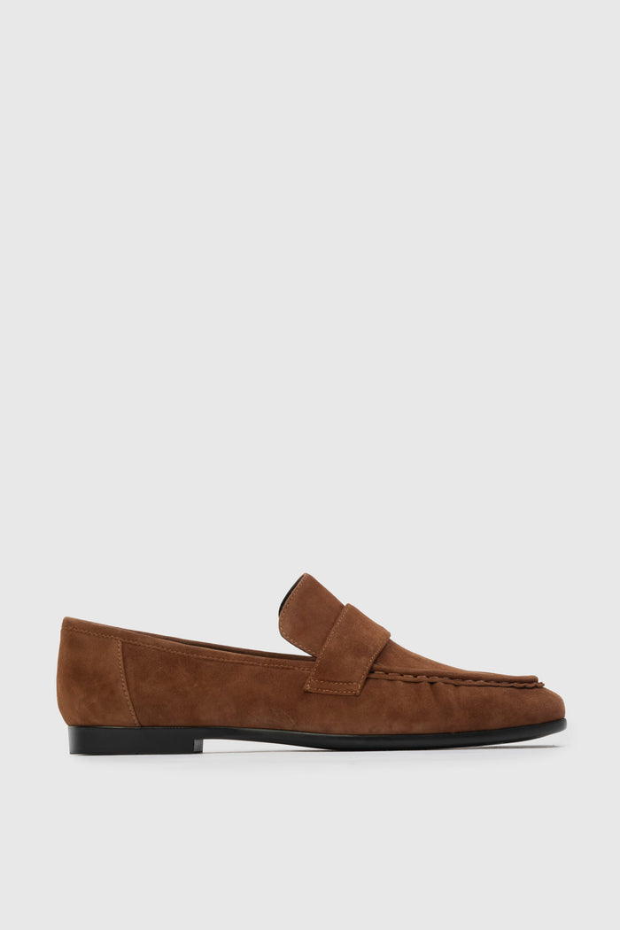 Brown loafer shoe on a light gray background | Grid | Exclude