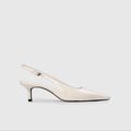 White slingback shoe on a light gray background | Lead