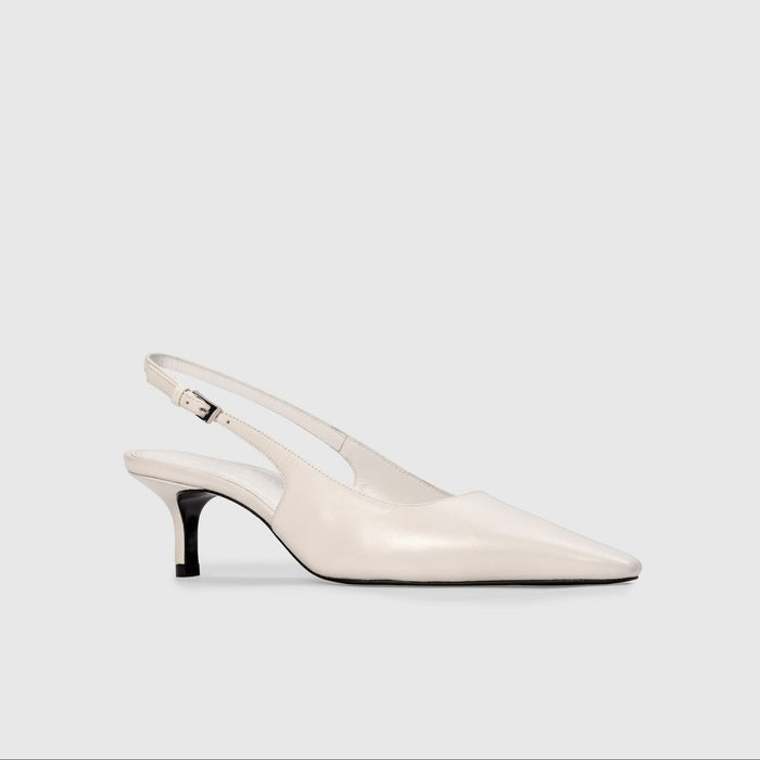 White slingback shoe on a light gray background