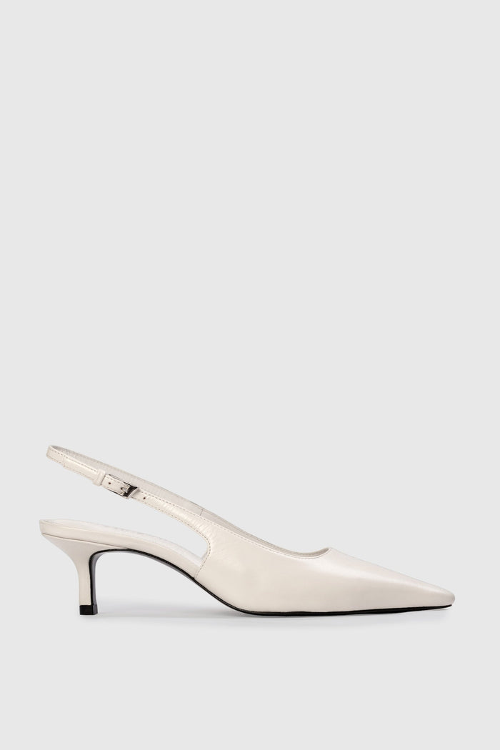 White slingback shoe on a light gray background | Grid | Exclude