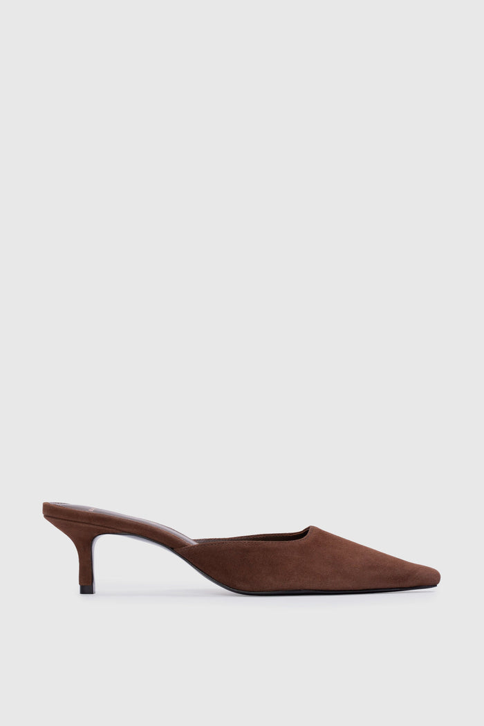 Brown suede high-heeled shoe on a light gray background | Grid | Exclude
