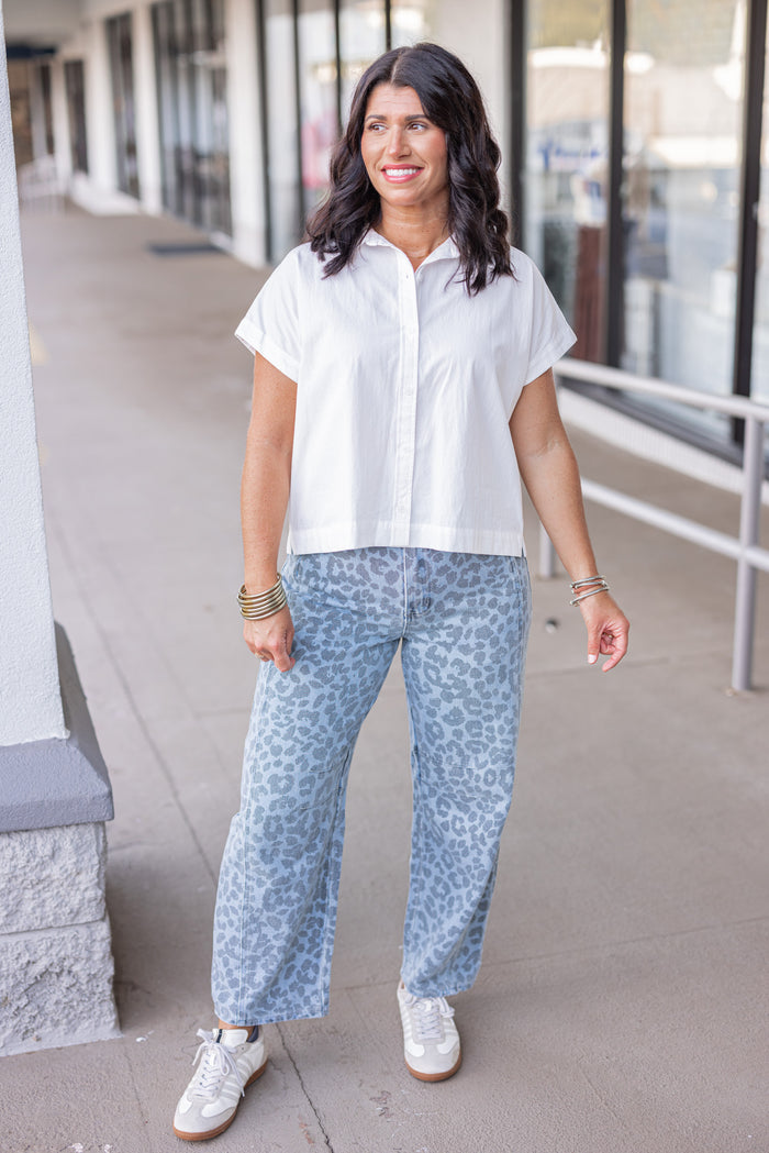 Washed blue and black leopard print barrel denim pants by Entro, perfect for fall weather