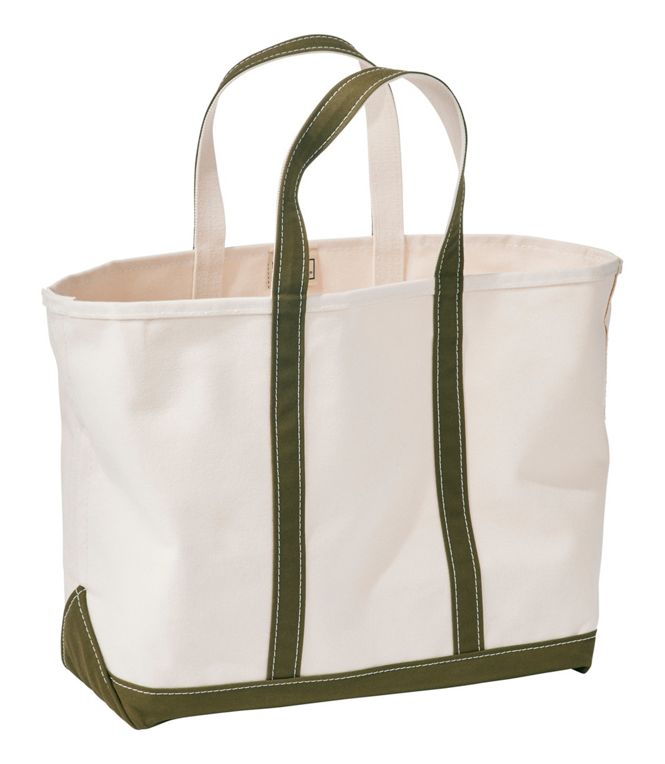 White tote bag with green handles and trim on a white background
