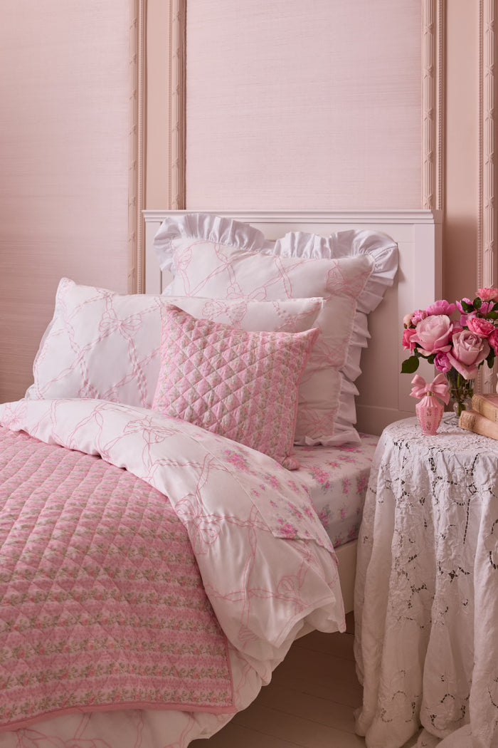 Pink and white floral plush bedding