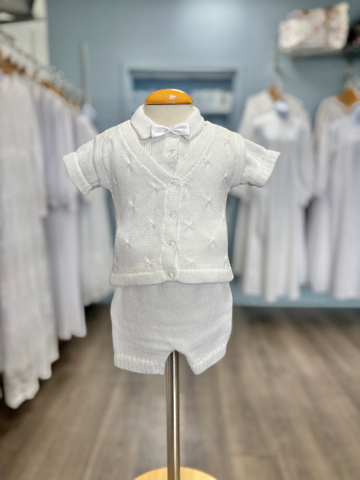 White knit baby boy outfit with bowtie.