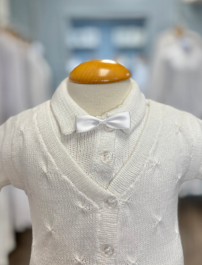 White knit baby boy outfit with bowtie.
