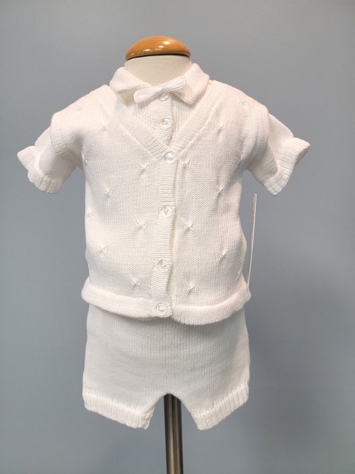 White knit baby boy outfit with bowtie.