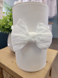 Cable knit bow baby headband.