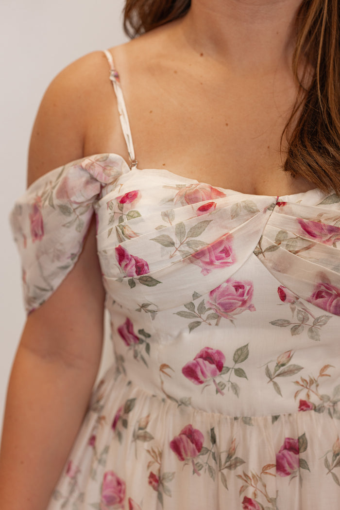 Off white with pink floral print event dress for women and teens showing close up view