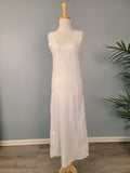 Full length white cotton slip with hem pocket.