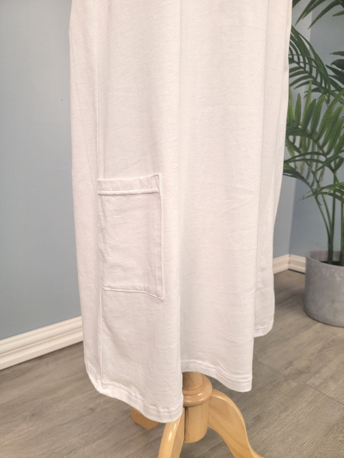 Full length white cotton slip with hem pocket.