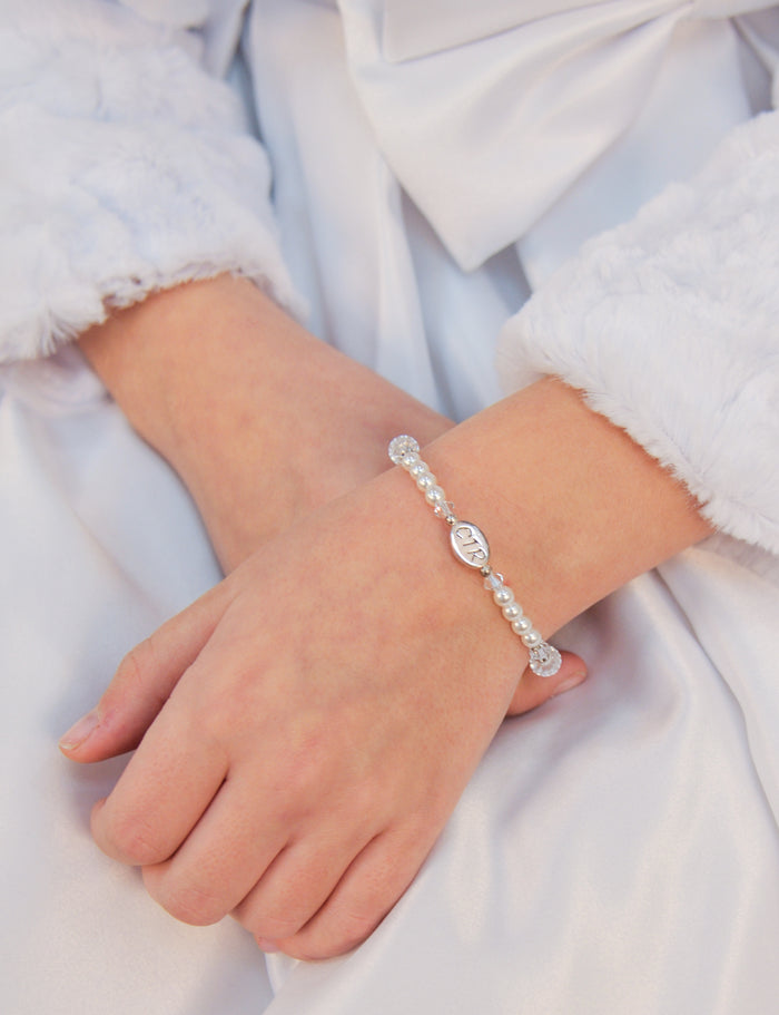 beaded pearl CTR bracelet on girls wrist.
