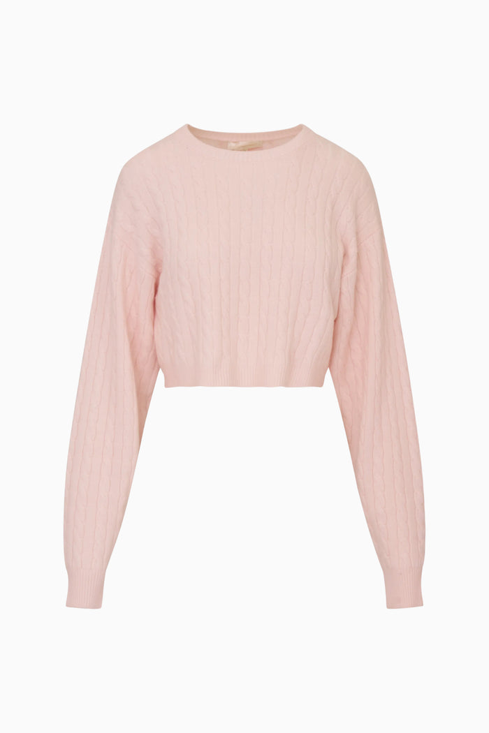 Light pink ribbed sweater on a white background