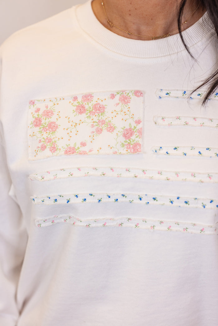 white pastel floral flag sweatshirt