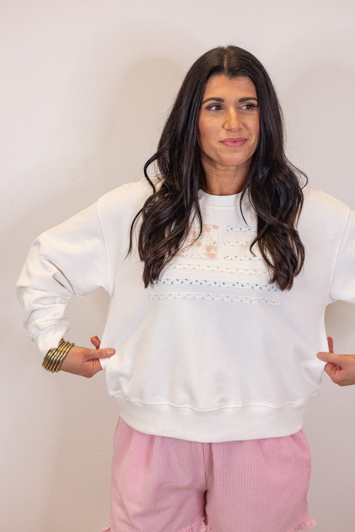 white pastel floral flag sweatshirt
