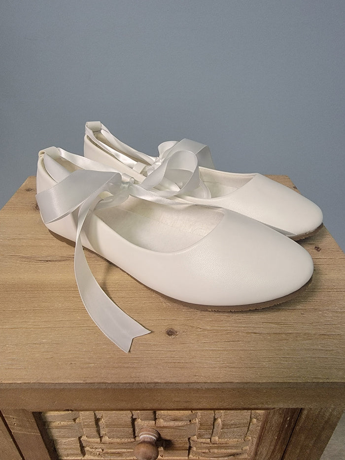 white ballerina flats with ribbon tie
