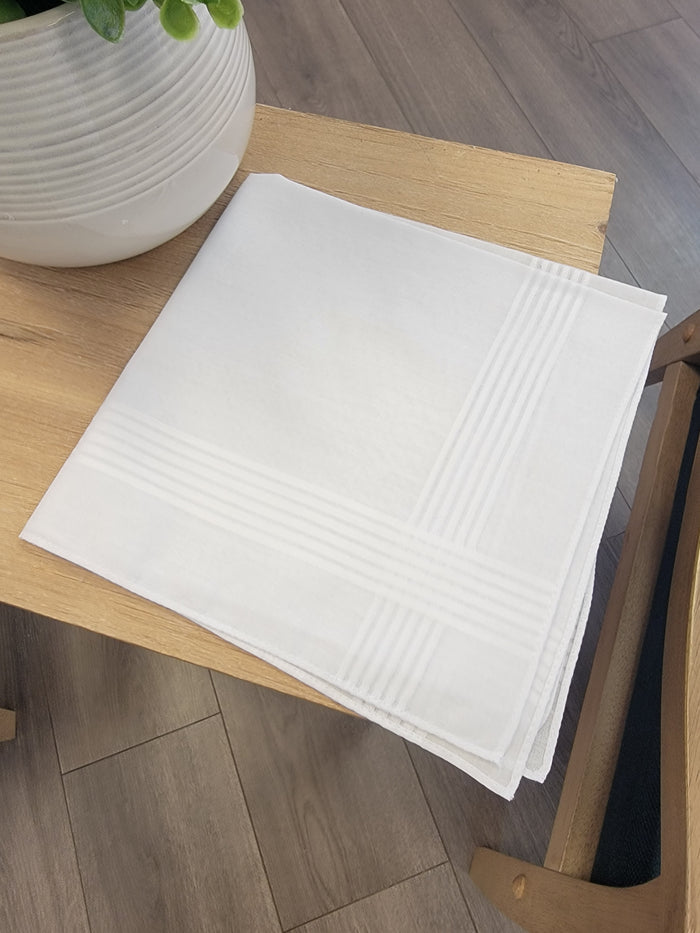 White handkerchief with white striped edges.