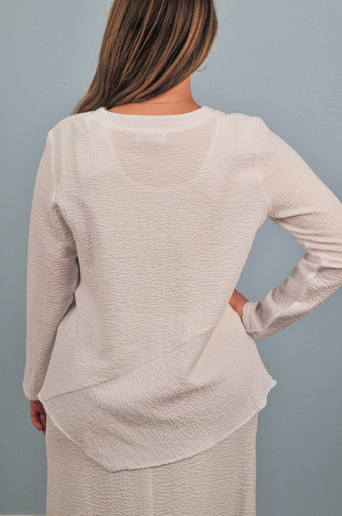 back of woman in blouse