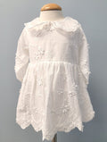 White floral baby dress with collar.