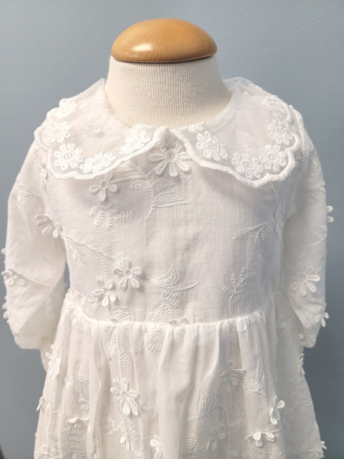 White floral baby dress with collar.