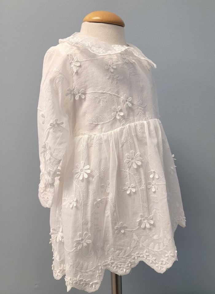 White floral baby dress with collar.
