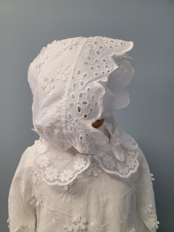 White baby dress with matching embroidered bonnet.