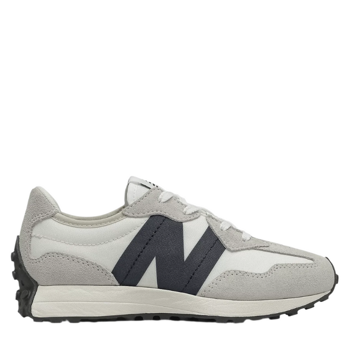 A pair of New Balance kids' running shoes with a gray and black color scheme, featuring a wedge silhouette and 'N' branding on the side.