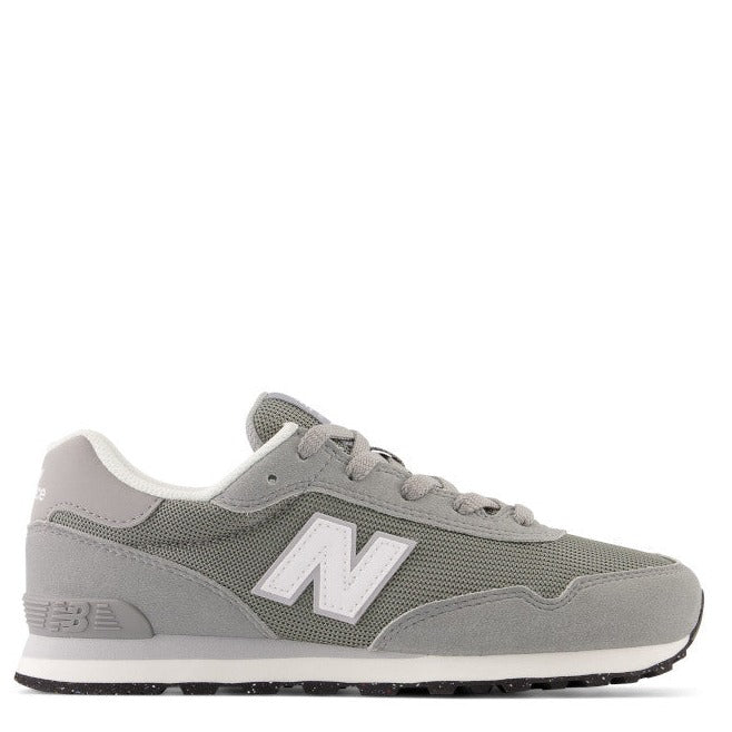 A pair of New Balance 515 sneakers with lace-up closure, featuring a gray canvas and suede upper with a visible New Balance logo, a wedge platform, and a non-marking rubber outsole.