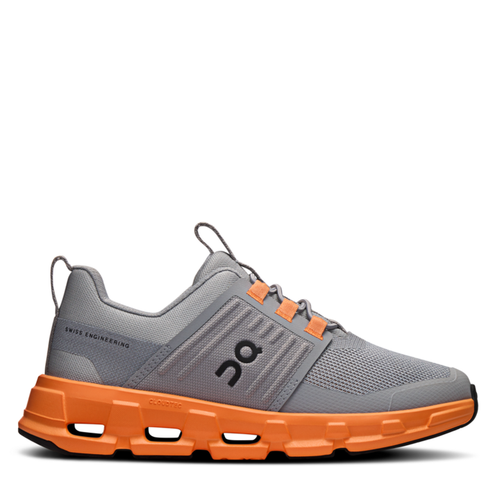 Children's athletic shoe with a gray mesh upper and orange sole, featuring elastic laces and a pull tab.