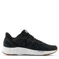 A pair of black New Balance sneakers with lace-up closure and the brand's logos on the side and sole.