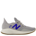 Gray athletic shoe with blue 'N' logo on a white background