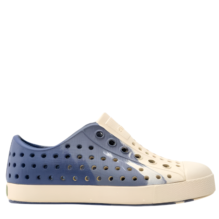 A pair of kids' casual shoes with a blue and white color scheme, featuring a perforated upper and a flat sole.