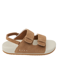 A brown sandal with multiple straps, designed for little kids, with the brand Reef visible.