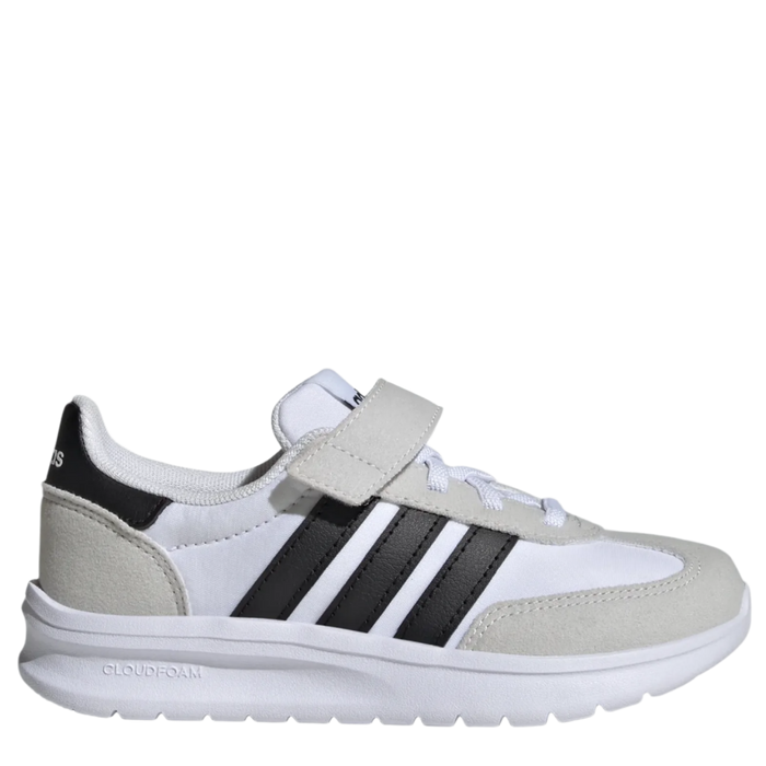 A pair of kids' athletic shoes with white uppers, black stripes, and a beige outsole.
