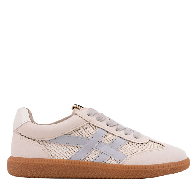 A beige sneaker for kids with silver faux-leather stripes, gray laces, and a brown sole.