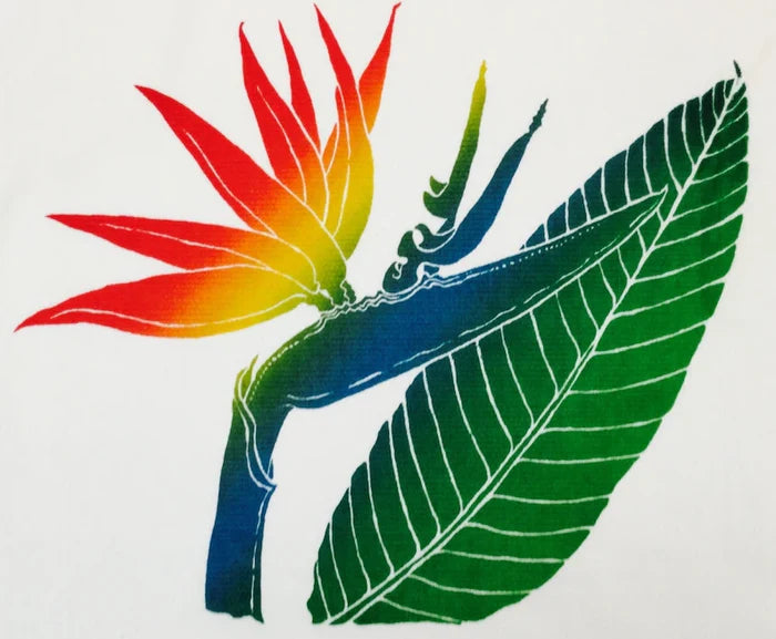 A colorful kitchen towel featuring a hand-screened tropical Bird of Paradise design with green leaves and a multicolored flower.