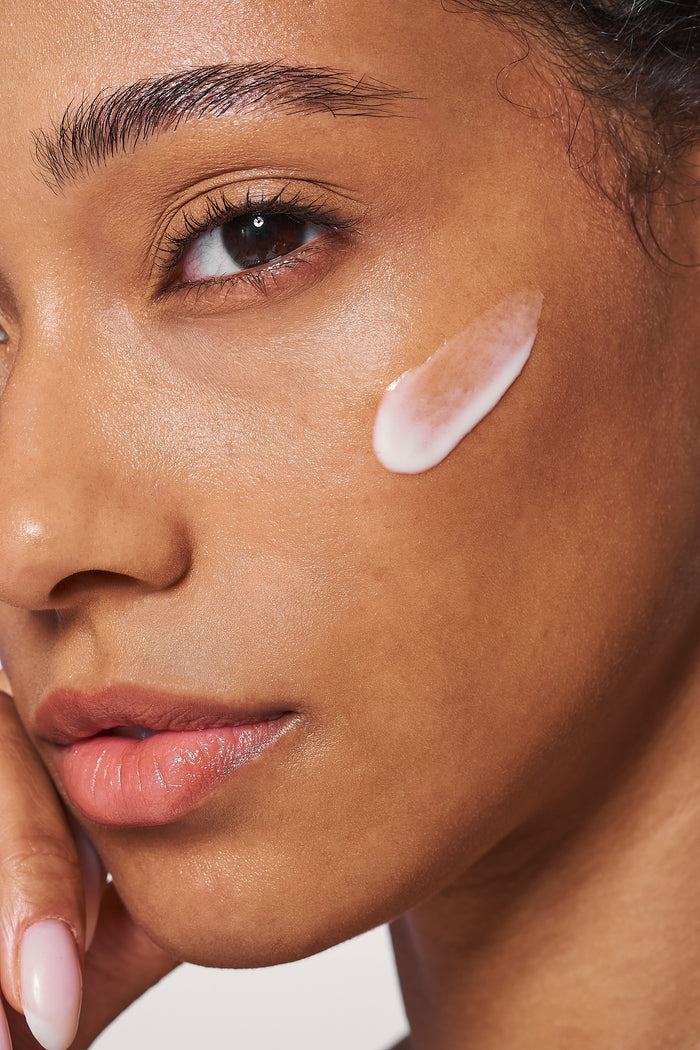 White skin serum on woman's face