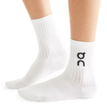 A pair of  adult crew length white socks with a black On Running logo on a white background